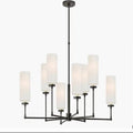 Chandelier with white shades and black metal frame on a white background, branded 'Visual Comfort'.