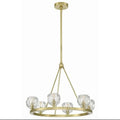 Gold chandelier with crystal shades on a white background, featuring Crystorama branding.